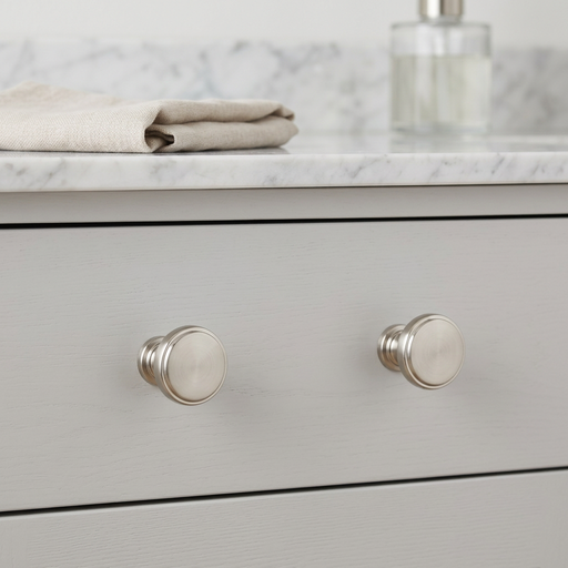 Richelieu 8726 brushed nickel cabinet knob set of 2 installed on grey drawer