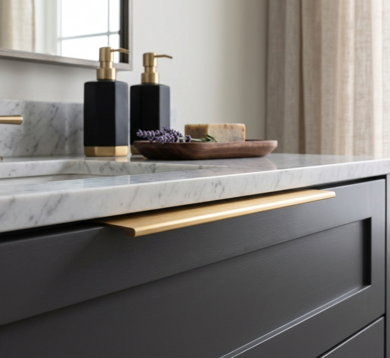 Richelieu 9898 aluminum edge pull installed on a modern black drawer