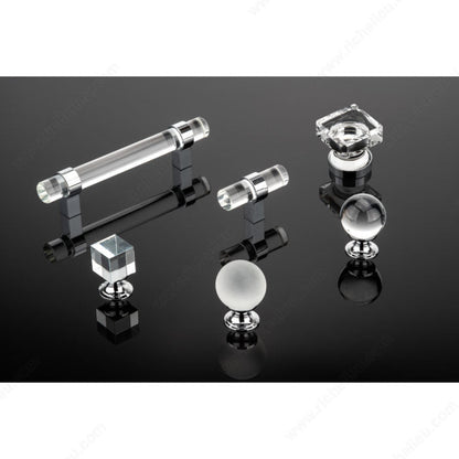 Richelieu glass hardware collection with chrome bases on reflective black surface