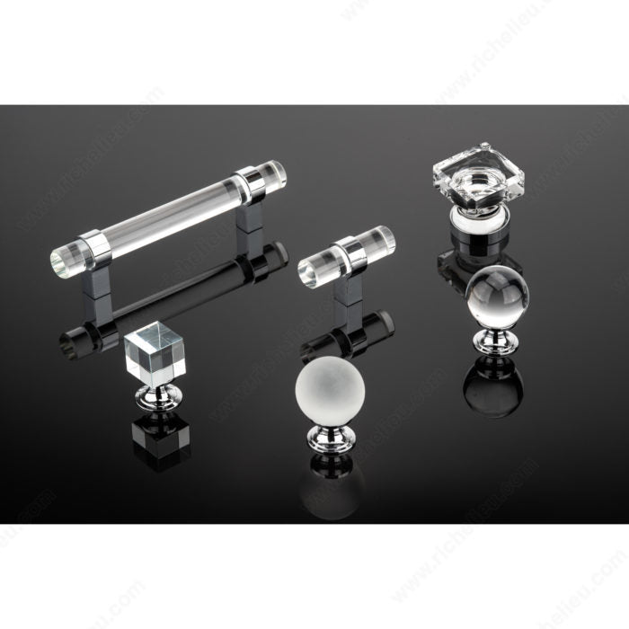 Richelieu glass hardware collection with chrome bases on reflective black surface
