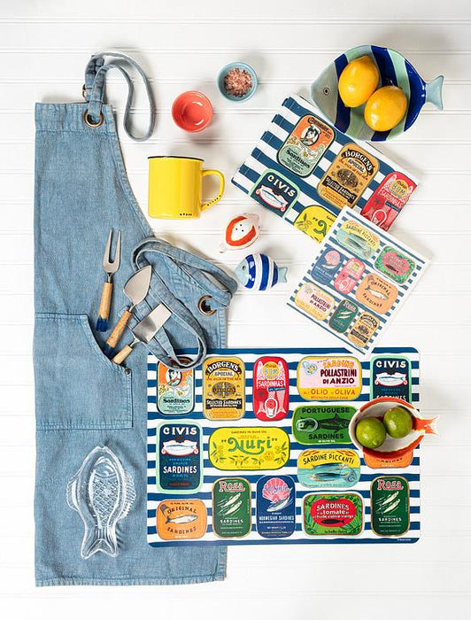 Sardine tins kitchen towel styled with lemons and kitchen accessories in coastal setting