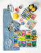 Sardine tins kitchen towel styled with lemons and kitchen accessories in coastal setting