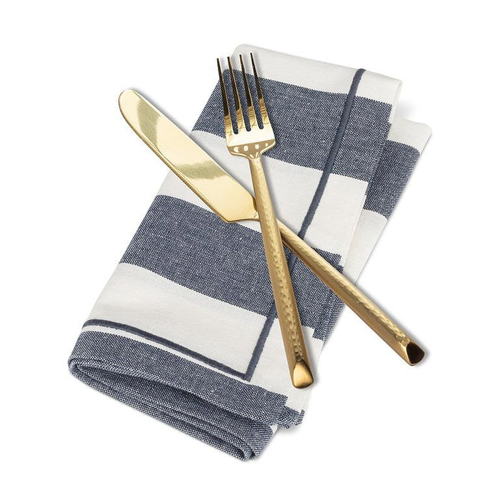 Blue and ivory striped cotton napkin styled with gold knife and fork