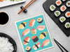 Swedish dishcloth with sushi design used in kitchen cleaning setting