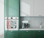Toronto street names kitchen towel displayed on oven in modern kitchen setting