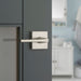 Weiser Lisbon Square Privacy Door Lever Satin Nickel Installed on Bathroom Door