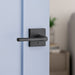 Weiser Lisbon Square Matte Black Privacy Door Lever Installed on Interior Door