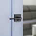 Weiser Lisbon Square Matte Black Privacy Door Lever Installed on Interior Door