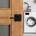 Weiser Lisbon Square Matte Black Passage Door Lever Installed on Interior Door