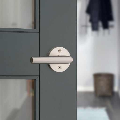 Weiser Milan round dummy door lever satin nickel installed on interior door