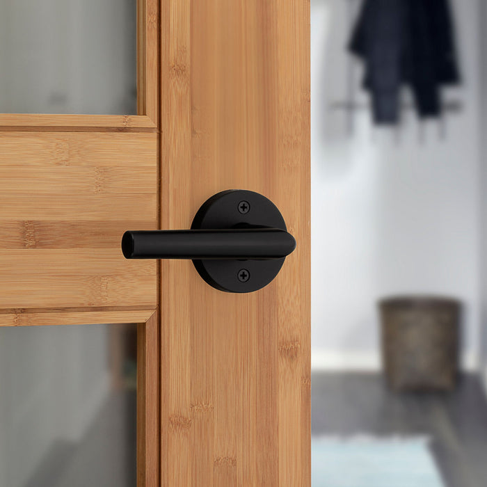 Weiser Milan round dummy door lever matte black installed on interior door