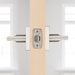 Side view of Weiser Montreal door handle installed on a light wood interior door.