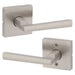 Two Weiser Montreal Satin Nickel door levers showing slim square-tapered design.