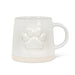 White stoneware mug with raised paw print design and wide natural-toned base