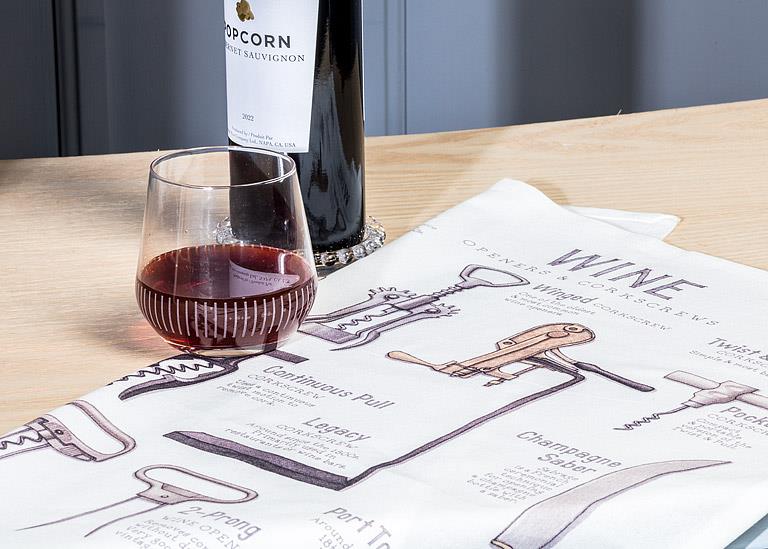 Wine openers kitchen towel displayed in modern kitchen setting with wine bottle and glass